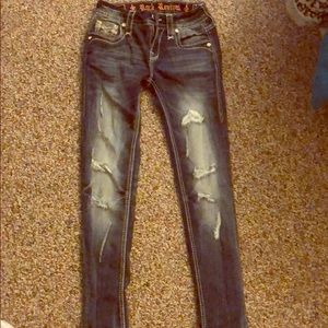 Mid rise skinny size 24 rock revival jeans.